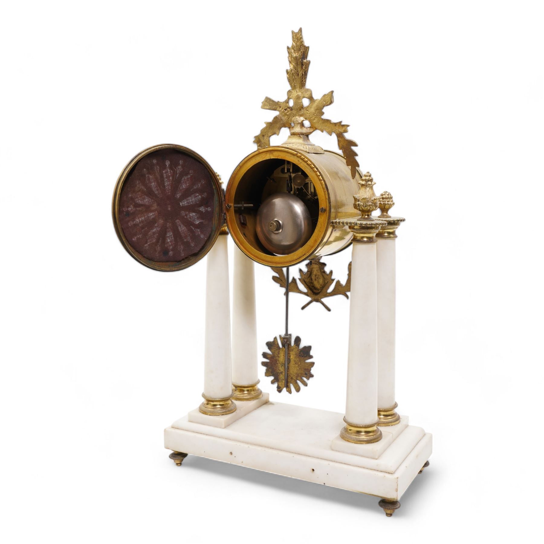 French - White marble and gilt 8-day mantel clock c1900,  with a rectangular plinth raised on four feet, gilt drum movement supported on four tapered pillars with gilt torus base and pineapple finials, convex enamel dial with floral swags and Arabic numerals, minute markers and gilt Louis XV hands, twin train Parisian countwheel striking movement, striking the hours and half-hours on a bell. With a sunburst pendulum.