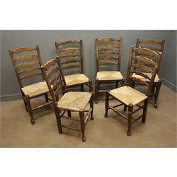  Set six 19th century oak ladder back dining chairs, rushed seats, turned supports and stretchers  