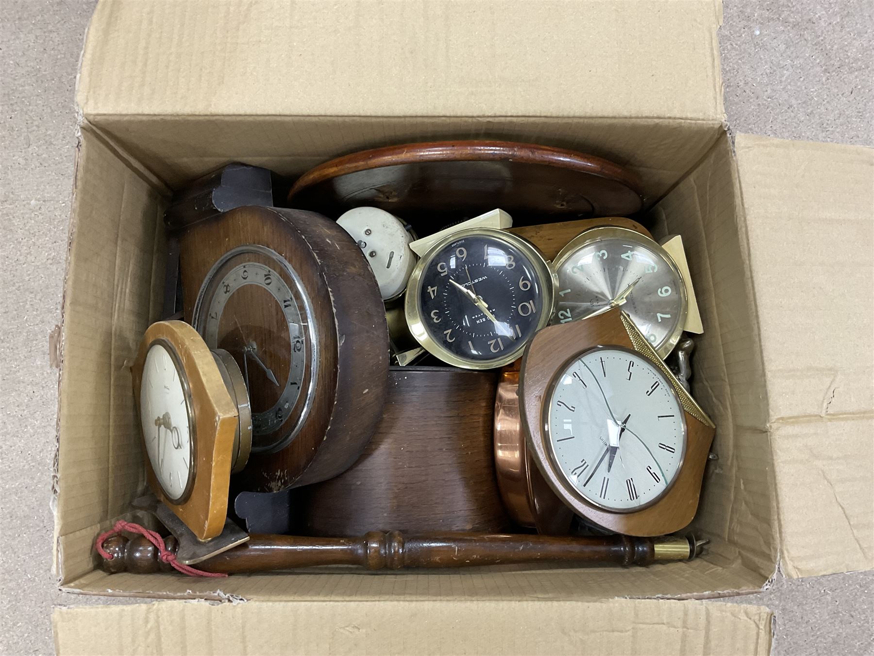 Assortment of alarm clocks and mantle clocks