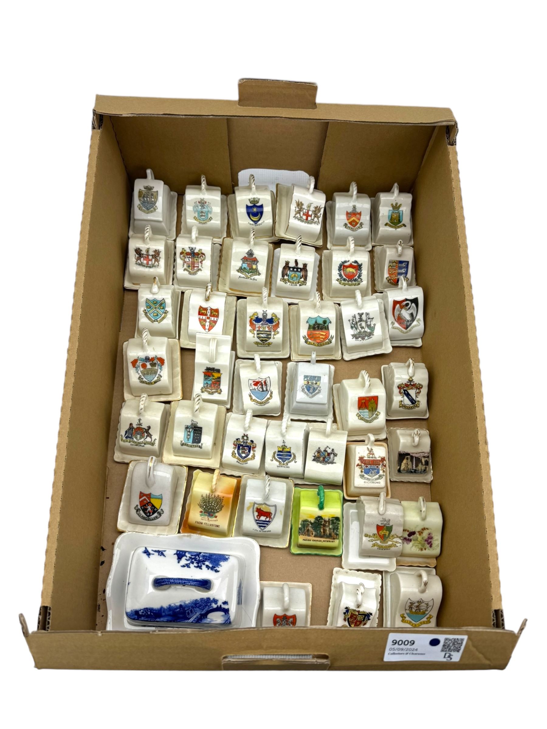 Collection of crested ware miniature cheese dishes and covers, including one by Goss, in one box