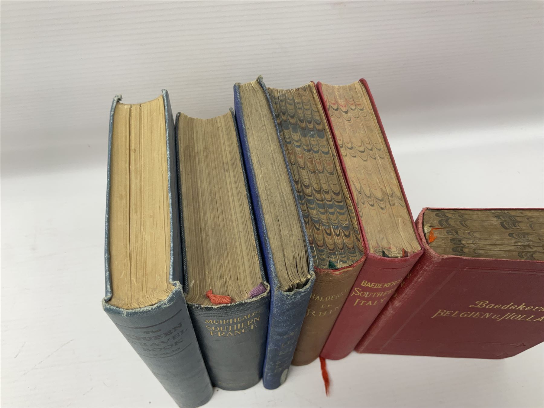 Collection of travel books, including Baedekers Belgien und Holland, Muirhead's Southern France, The Queen Travel Book 1929-30 