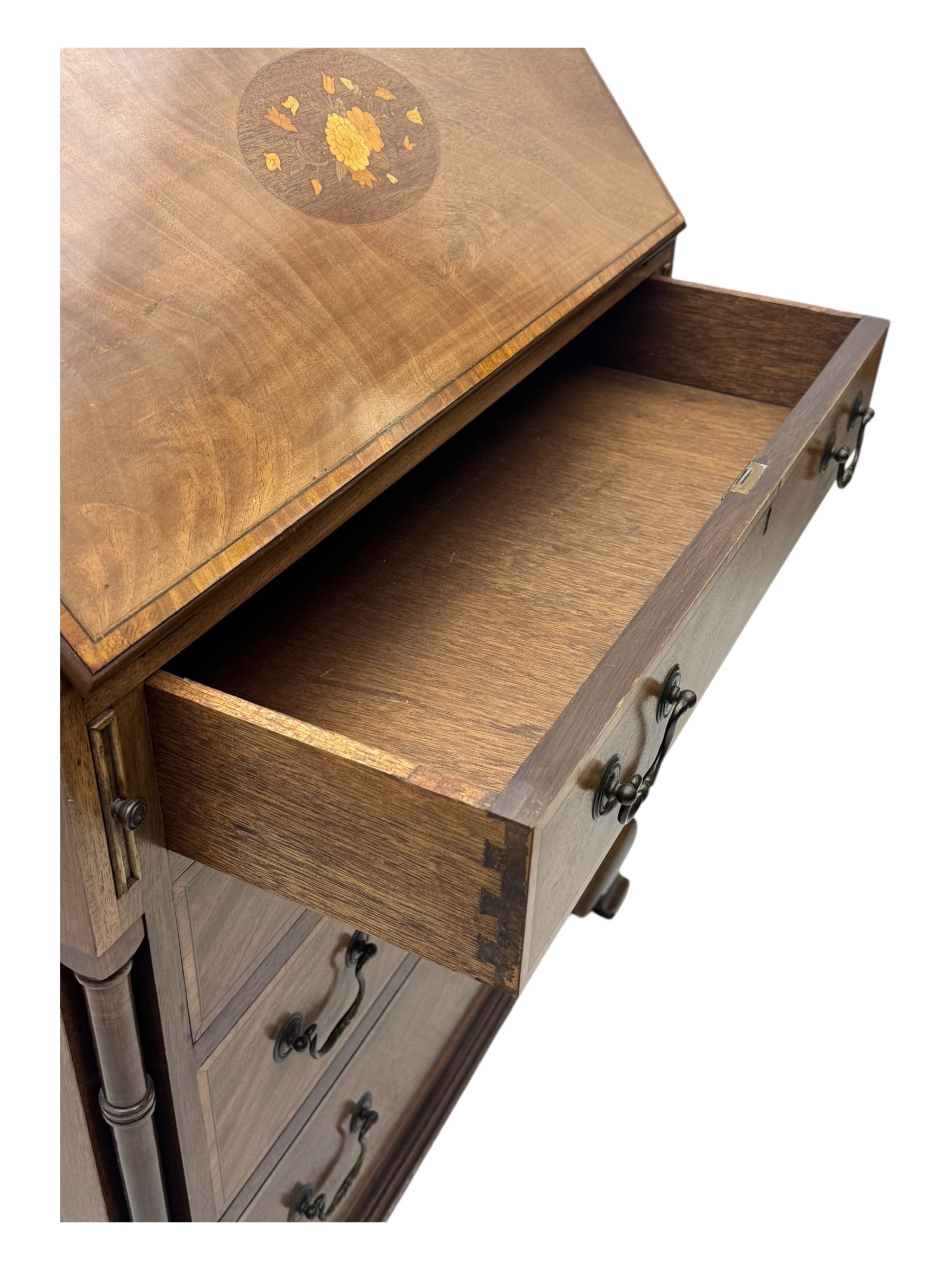 Georgian design mahogany bureau, moulded fall front with central floral inlays and satinwood band, fitted with four graduating drawers enclosed by ring turned pillars, on ogee bracket feet 