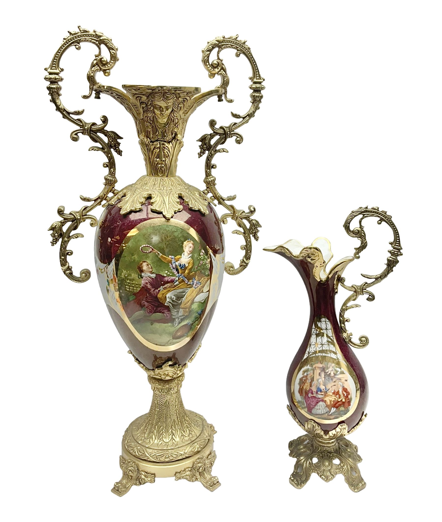 Twin handled vase, the ceramic urn form body decorated with floral sprigs and figural panel, the metal handles designed as vines, together with a similar ewer, vase H75cm 