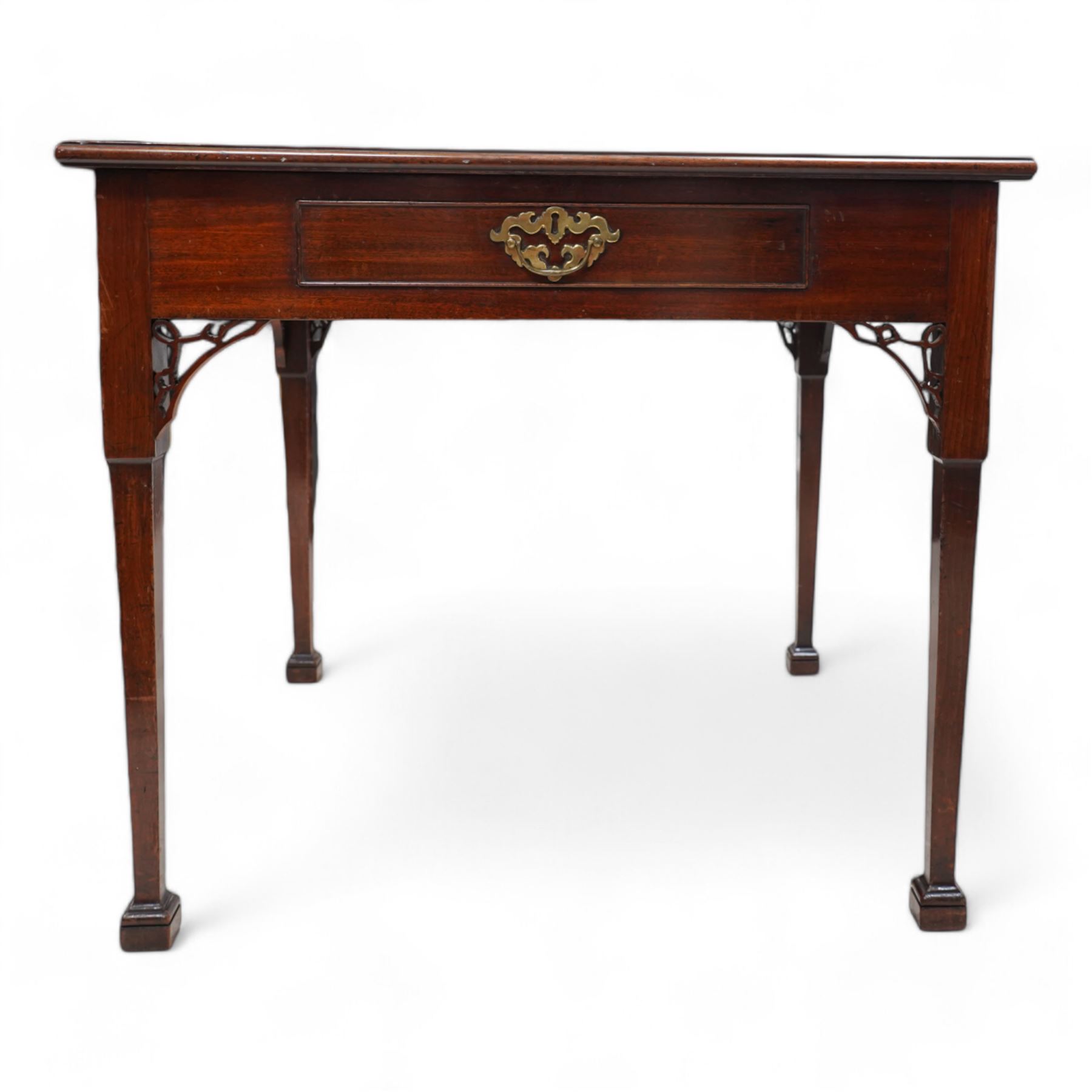 George III mahogany table, fixed square top with moulded edge, fitted with single cock-beaded drawer, pierced corner brackets, on square tapering supports with spade feet 