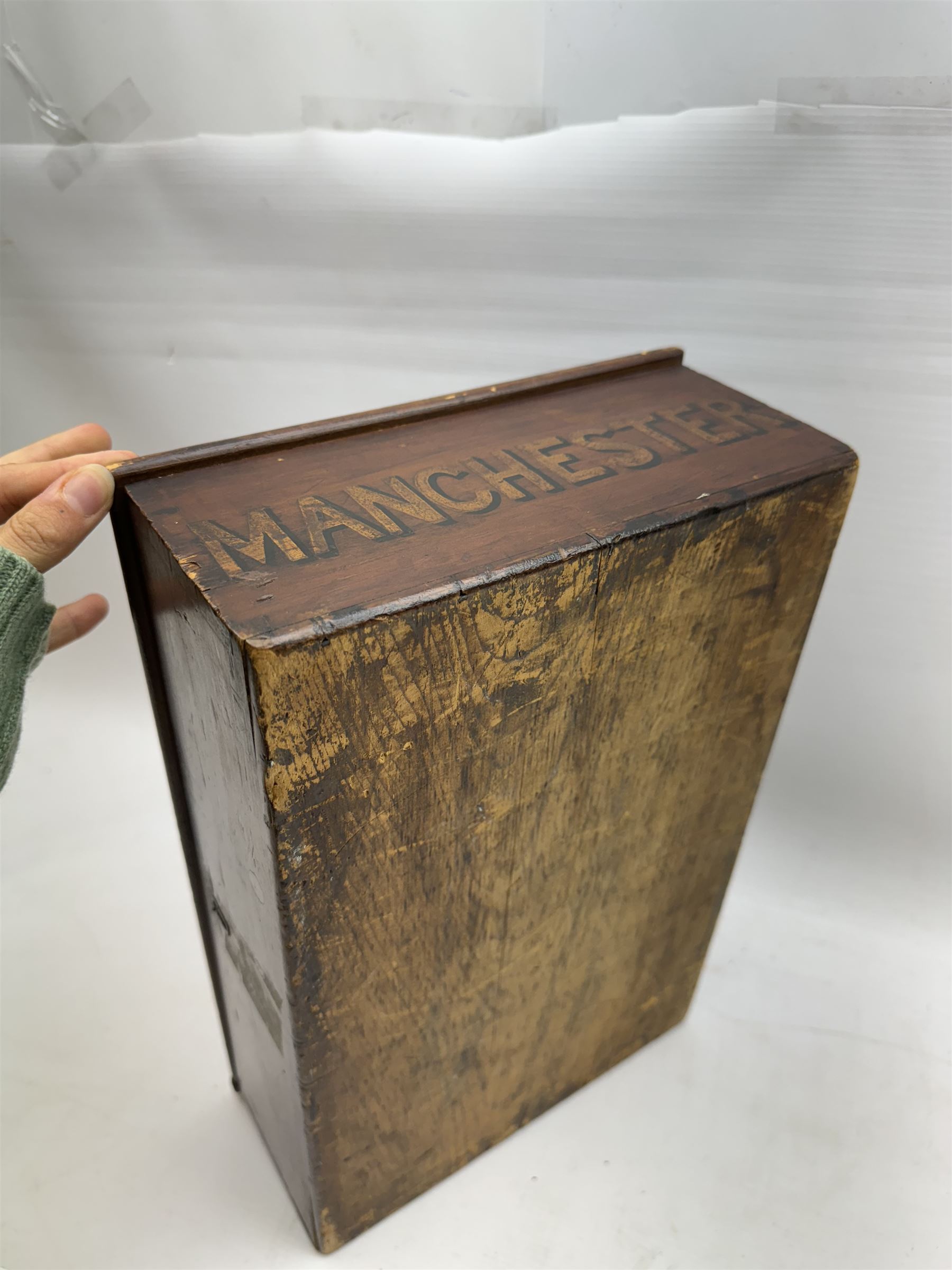 Wooden storage box, with hinged lid, marked Manchester to one side, H11cm, L38cm, D25cm 