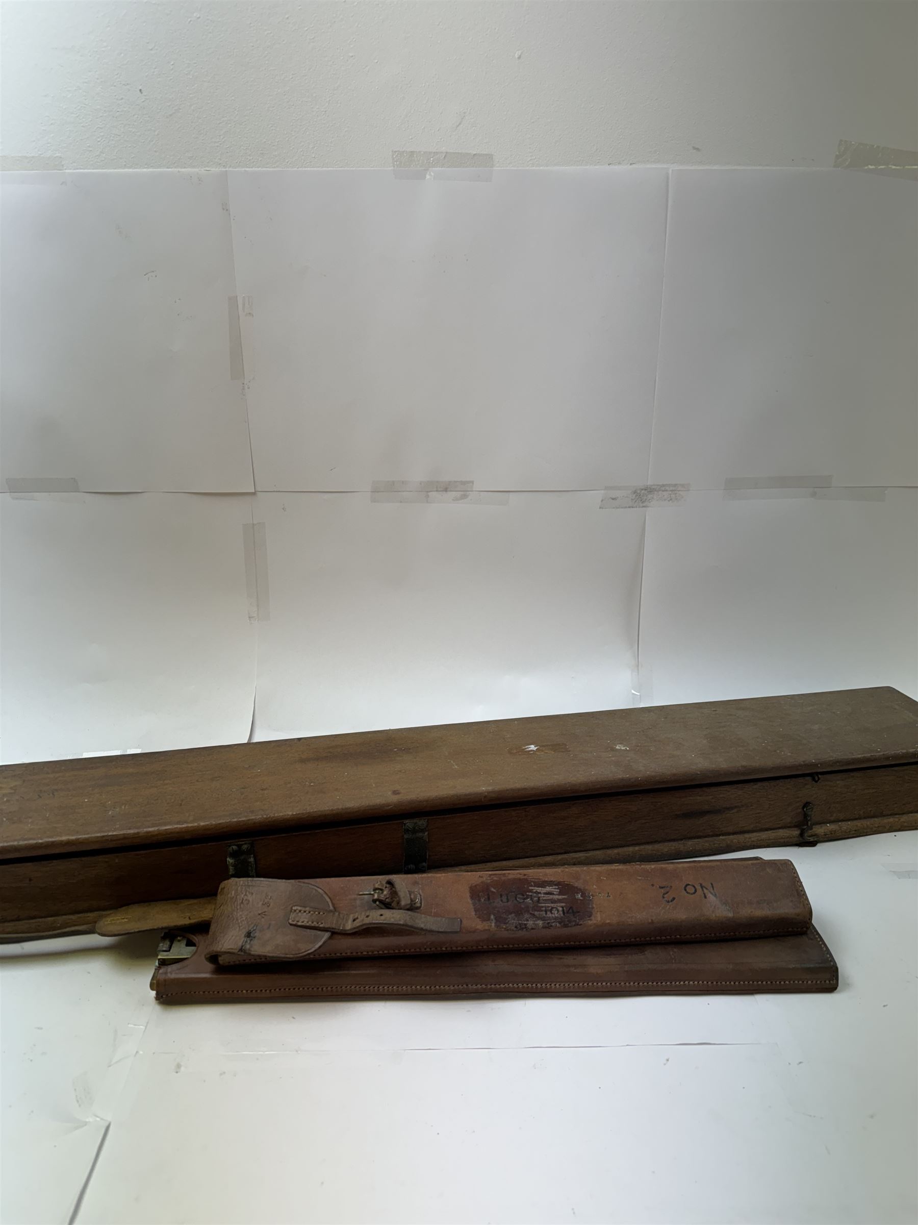 Early 20th century drawing instruments, to include a boxed set of large compasses, possibly for map drawing, marked 5, 6 and 7 miles, in fitted wooden case, together with two rules marked W. Harling and a parallel rule stamped R. E & Co MK II, all with broad arrow mark, contained within leather cases