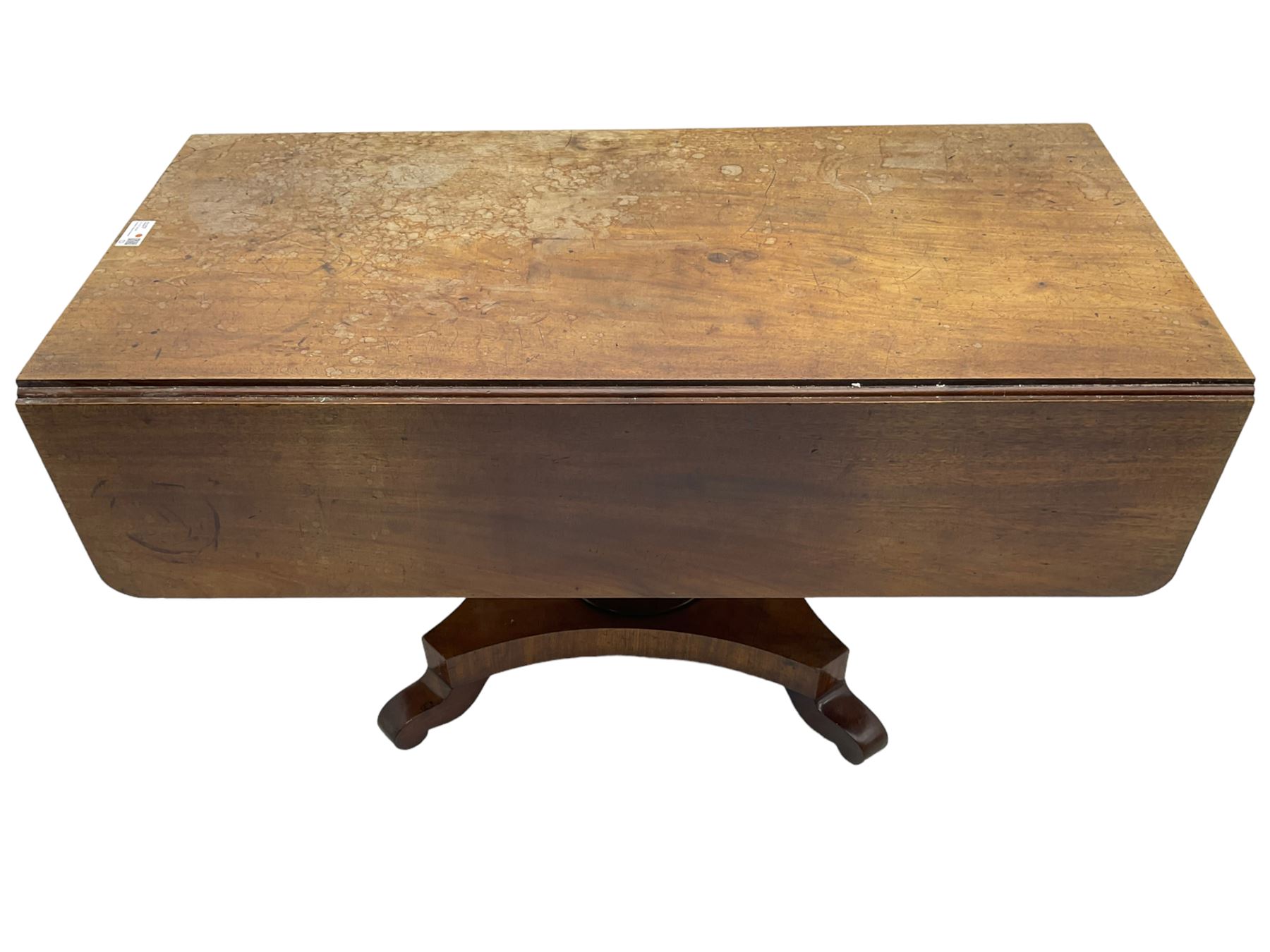 Victorian mahogany supper table, rectangular drop-leaf top with rounded corners, tapered octagonal column on concaved rectangular platform with splayed shaped feet