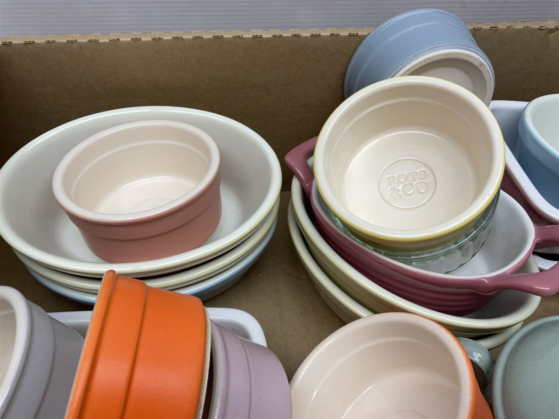 Collection of pastel coloured ramakins and pie dishes, including examples by Tala and Pots & Co, etc