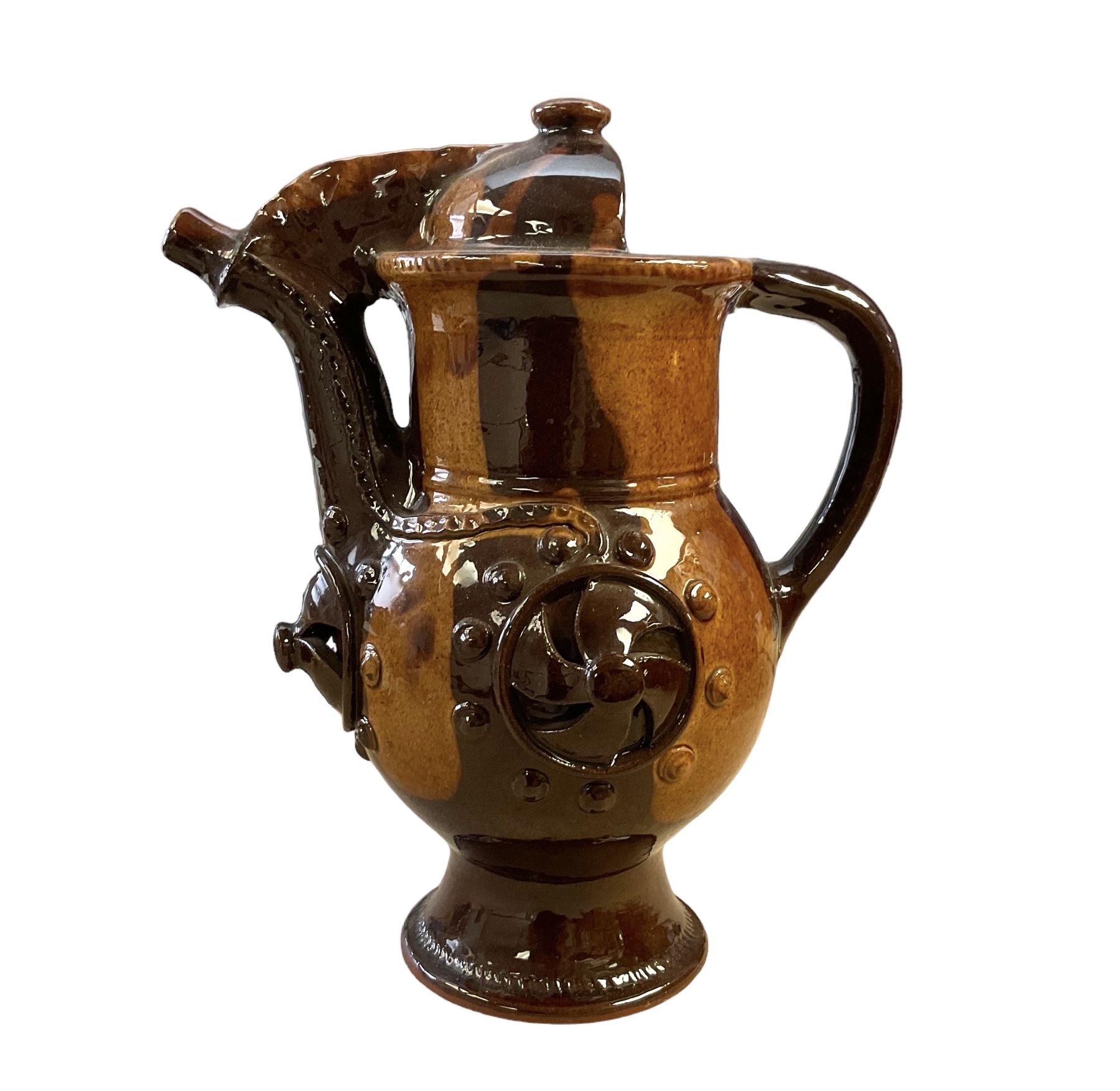 Treacle glaze pottery puzzle jug, H28cm