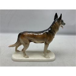 Two Hertwig and Co Katzhutte figures of dogs, comprising a German Shepherd and a pointer dog, both with printed marks beneath, largest H21.5cm W25cm