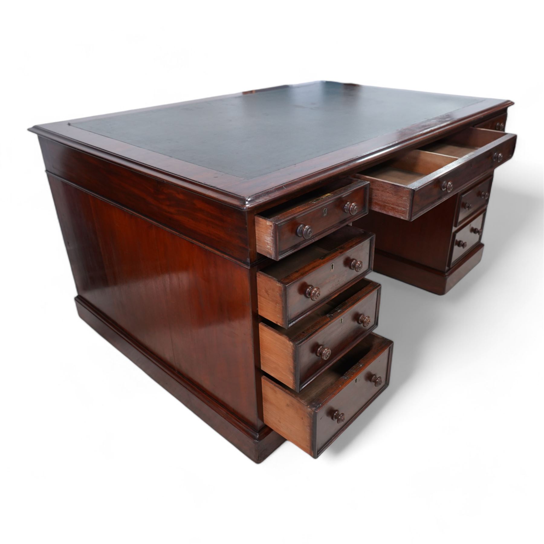 Victorian mahogany twin pedestal desk, moulded rectangular top with leather inset, one side fitted with nine drawers, the opposing side fitted with three drawers and two cupboards, two panelled doors enclosing further drawers, on moulded plinth base 