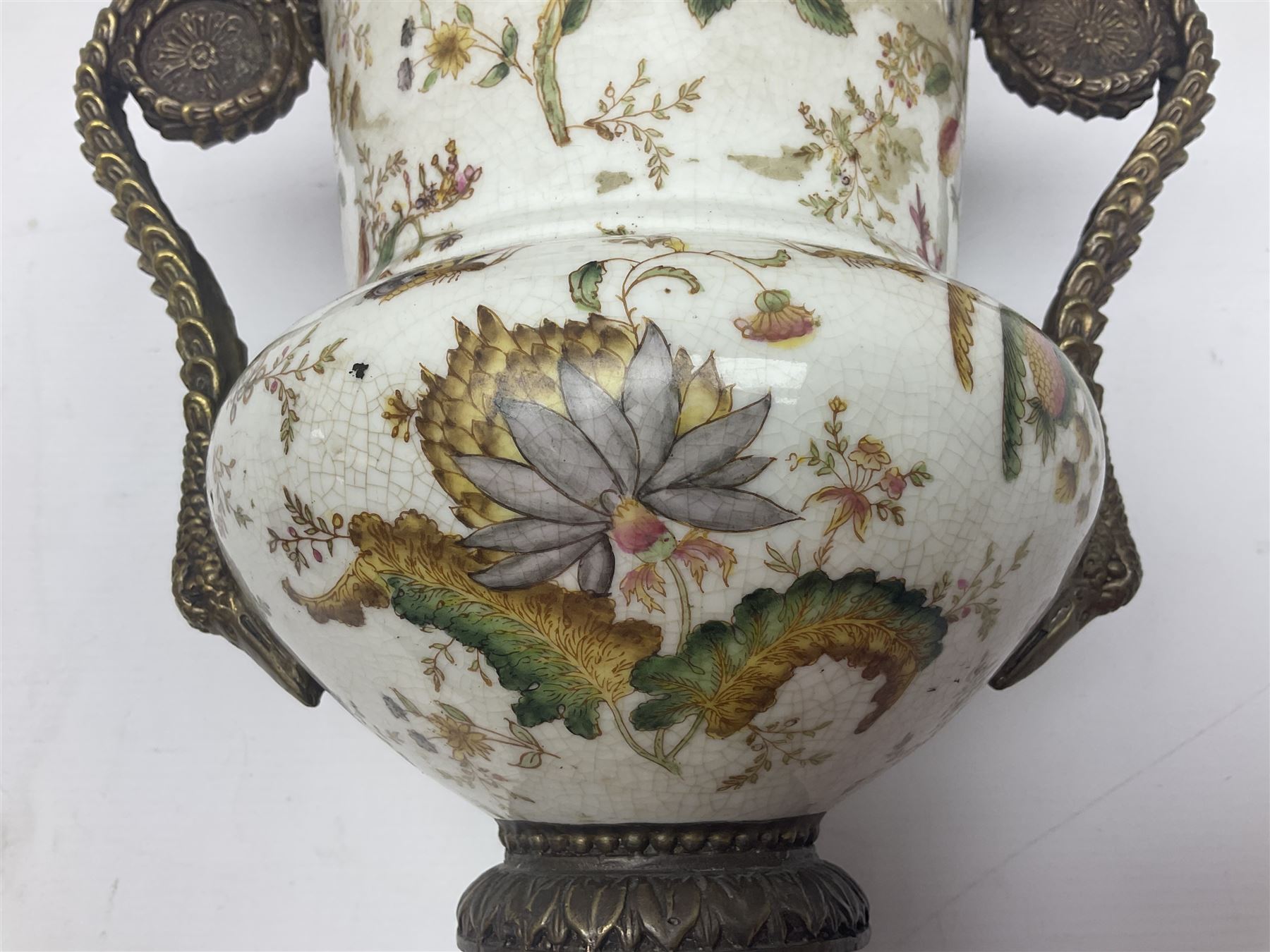 Wong Lee, twin handled ceramic urn with enamelled floral decoration and bronzed metal mounts, marked to base, height 33cm