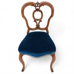 Set of six Victorian carved walnut dining chairs, shaped cresting rail over C-scroll splat back, upholstered in blue velvet, on cabriole supports 