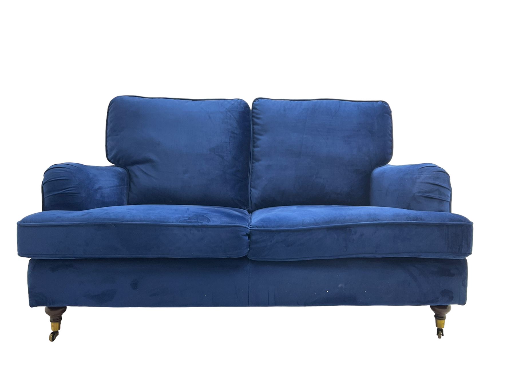 Howard design - two-seat sofa upholstered in blue fabric, traditional shape with rolled arms, on walnut finish turned feet with brushed metal cups and castors