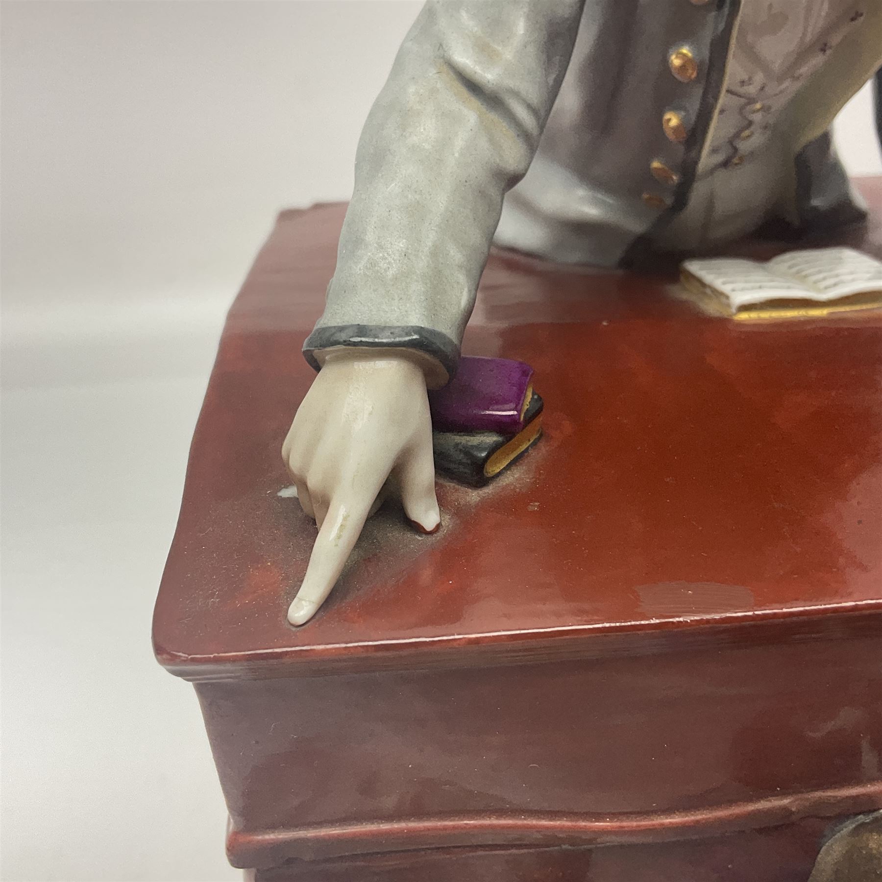 19th century Continental jar and cover, modelled as a classroom, with the teachers desk as the cover, H27cm