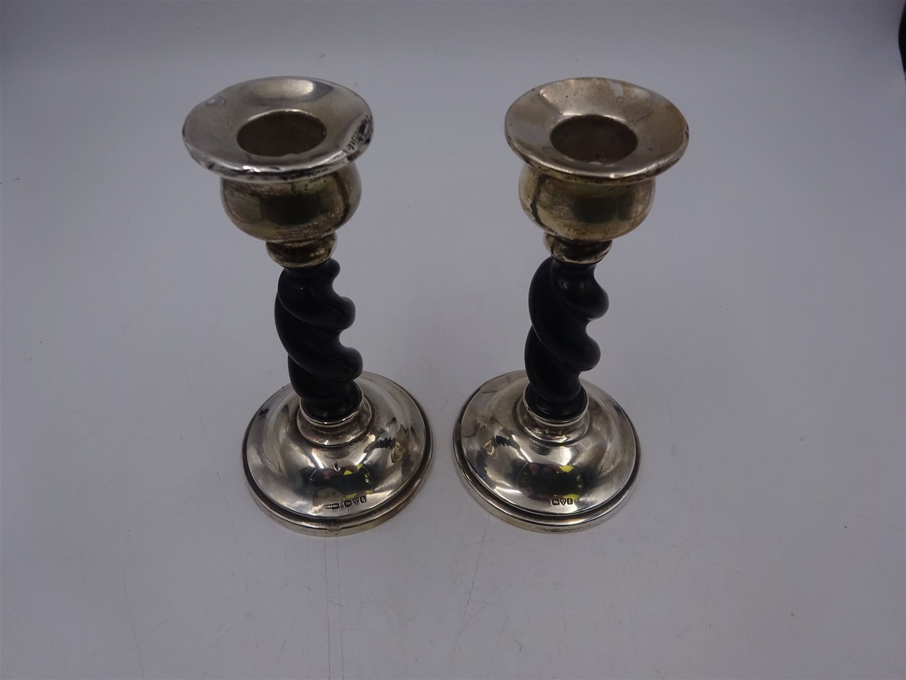 Pair of 1920s silver mounted ebonised barley twist candlesticks, hallmarked Payton, Pepper & Co, Chester 1927, H15cm