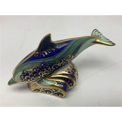 Three Royal Crown Derby paperweights, comprising Bottlenose Dolphin, Baby Bottlenose Dolphin and Striped Dolphin, all with gold stoppers 