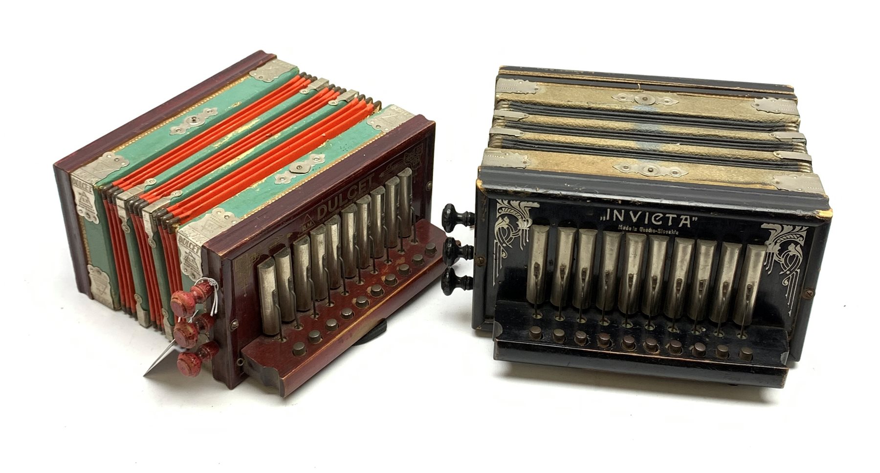 Czechoslovakian 'Invicta' accordion, the ebonised case with silvered decoration, thirteen buttons and three stops L28cm; and another similar by Dulcet Saxony (2)