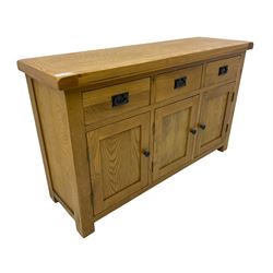 Contemporary light oak sideboard, fitted with three drawers over three panelled cupboards enclosing shelving, on square supports