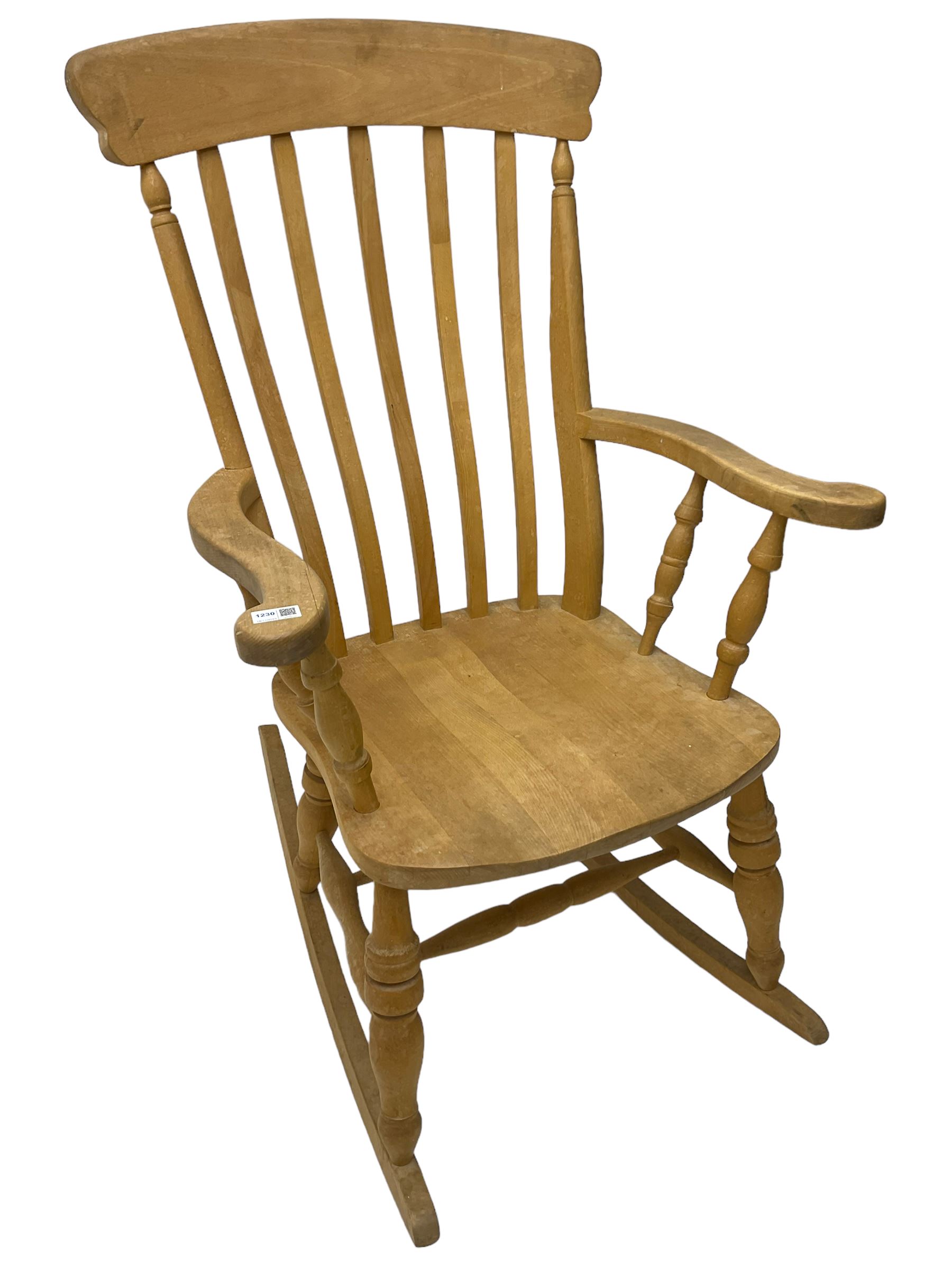 Farmhouse style beech rocking chair, shaped cresting rail on vertical slats, on turned front supports joined by swell-turned double H stretcher base