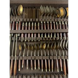 Wooden cased six place Thai gilt metal canteen of cutlery, together with additional matching flatware 