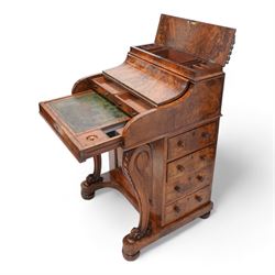 Victorian figured walnut piano top Davenport, the moulded top with brass gallery opens to reveal hidden compartment fitted with divisions, the piano lid enclosing slide with hinged leather writing surface, pen holder and two drawers, the right-hand side fitted with four drawers and the opposing side with four false drawers, on acanthus carved cabriole supports with scrolled terminals, sledge platform on turned feet 