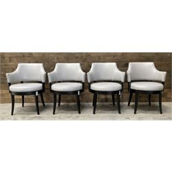 Four ebonised framed tub shaped armchairs, upholstered in grey fabric