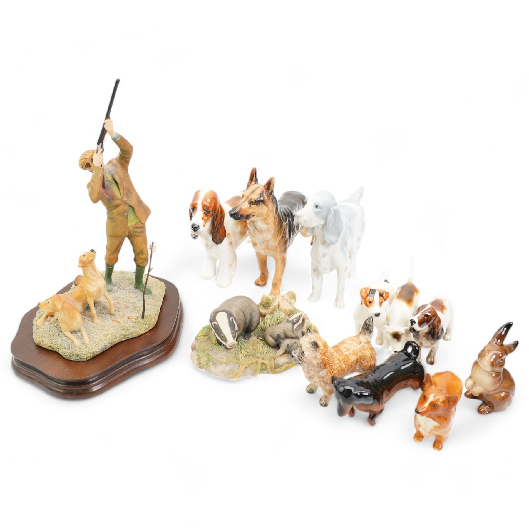 Border Fine Arts, Reaching for the High Bird (Labradors), by Ray Ayres, H26cm, Border Fine Arts badger group RW3, together with a Royal Doulton Cocker Spaniel HN1036, Royal Doulton Alsatian HN1116, together with other Royal Doulton and other models 