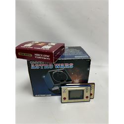 Three 1980s Nintendo Game & Watch handheld electronic games, to include a boxed Multi Screen Mario Bros example and two unboxed single screen examples Parachute and Fire, together with a Grandstand Astro Wars electronic game, boxed with instructions