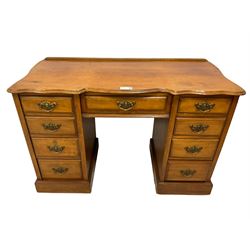 Late 19th century walnut twin pedestal desk, shaped moulded top over nine drawers, on moulded plinth base 