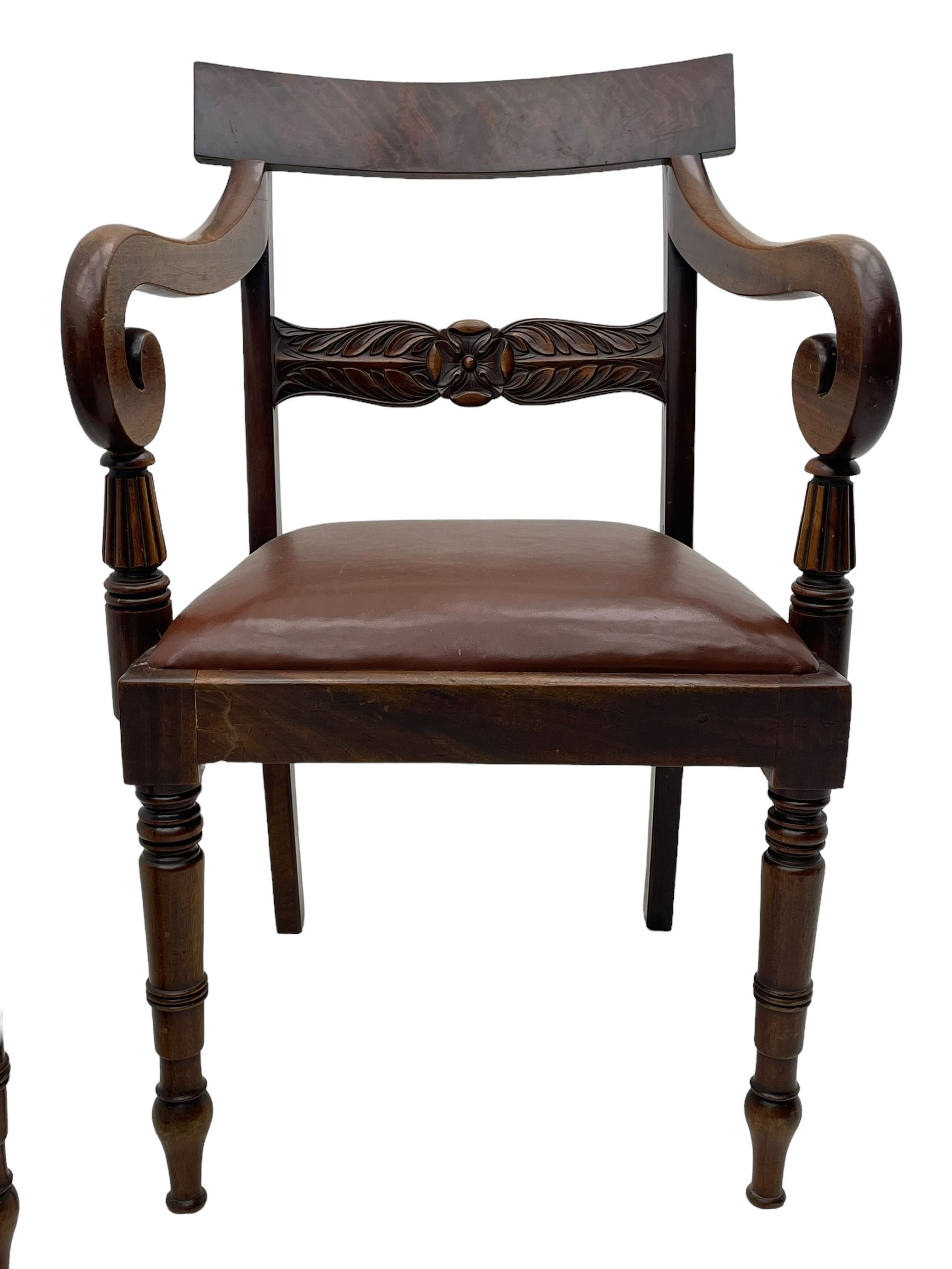 Set of six (4+2) early 19th century mahogany dining chairs, figured bar back over rose and curled leaf carved middle rail, drop-in seats upholstered in brown fabric, on turned front supports 