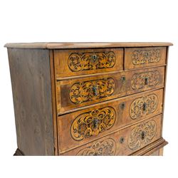 18th century inlaid walnut chest on stand, ovolo-moulded rectangular top inlaid with ebony panels each decorated with scrolling foliage, flower heads and birds, fitted with two short over three long drawers, the drawer fronts decorated with ebony panels enclosing curled leaf inlays, the base fitted with single drawer on turned supports united by waved stretchers, on turned bun feet 