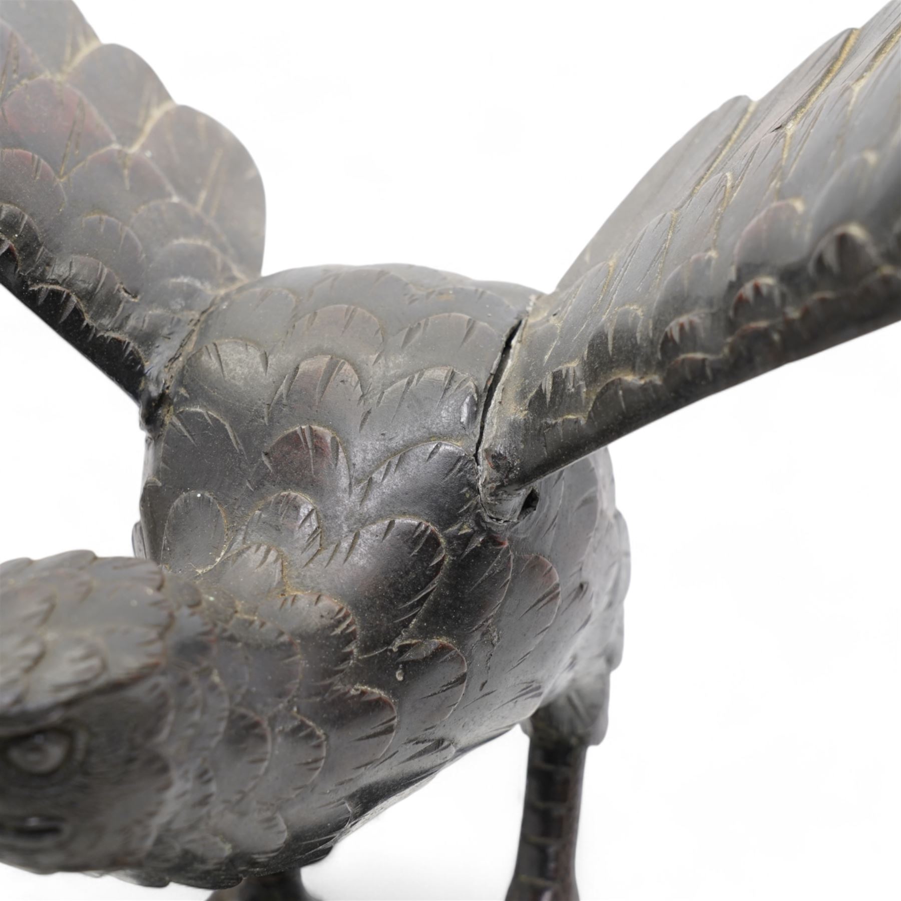 Japanese Meiji bronze eagle, raised upon a rock with crashing waves at the base, stood with outstretched wings H37cm