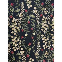 Embroidered Karandi fabric runner, the field featuring a black ground with an all-over floral design, including large pink and cream roses, accompanied by green leaves and small blossoms, bordered by plain sections at each end