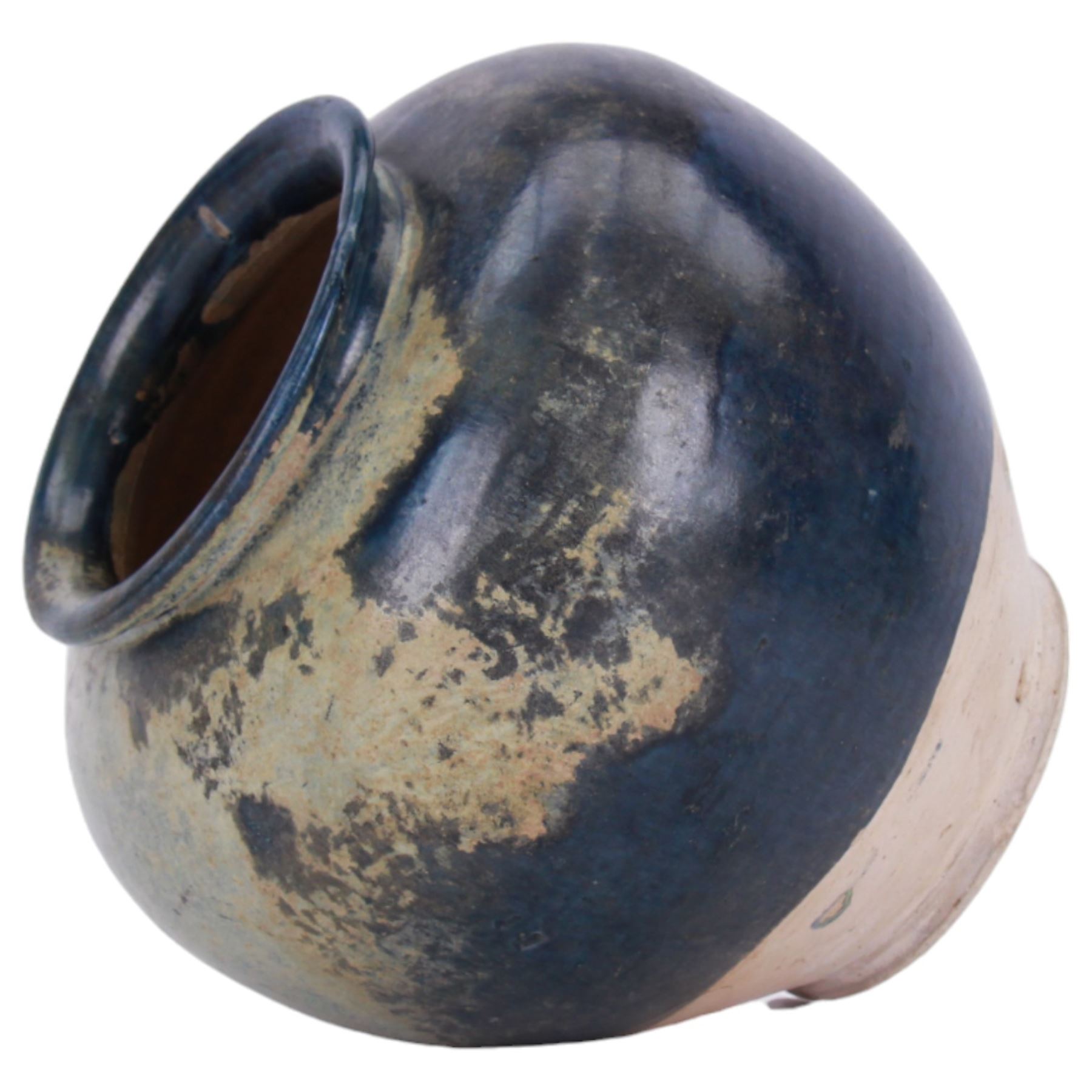 Tang Dynasty style blue-glazed pottery jar or vase, of ovoid form with short lipped rim, the body with cobalt and light blue lustre glaze finishing irregularly above the base, H19cm