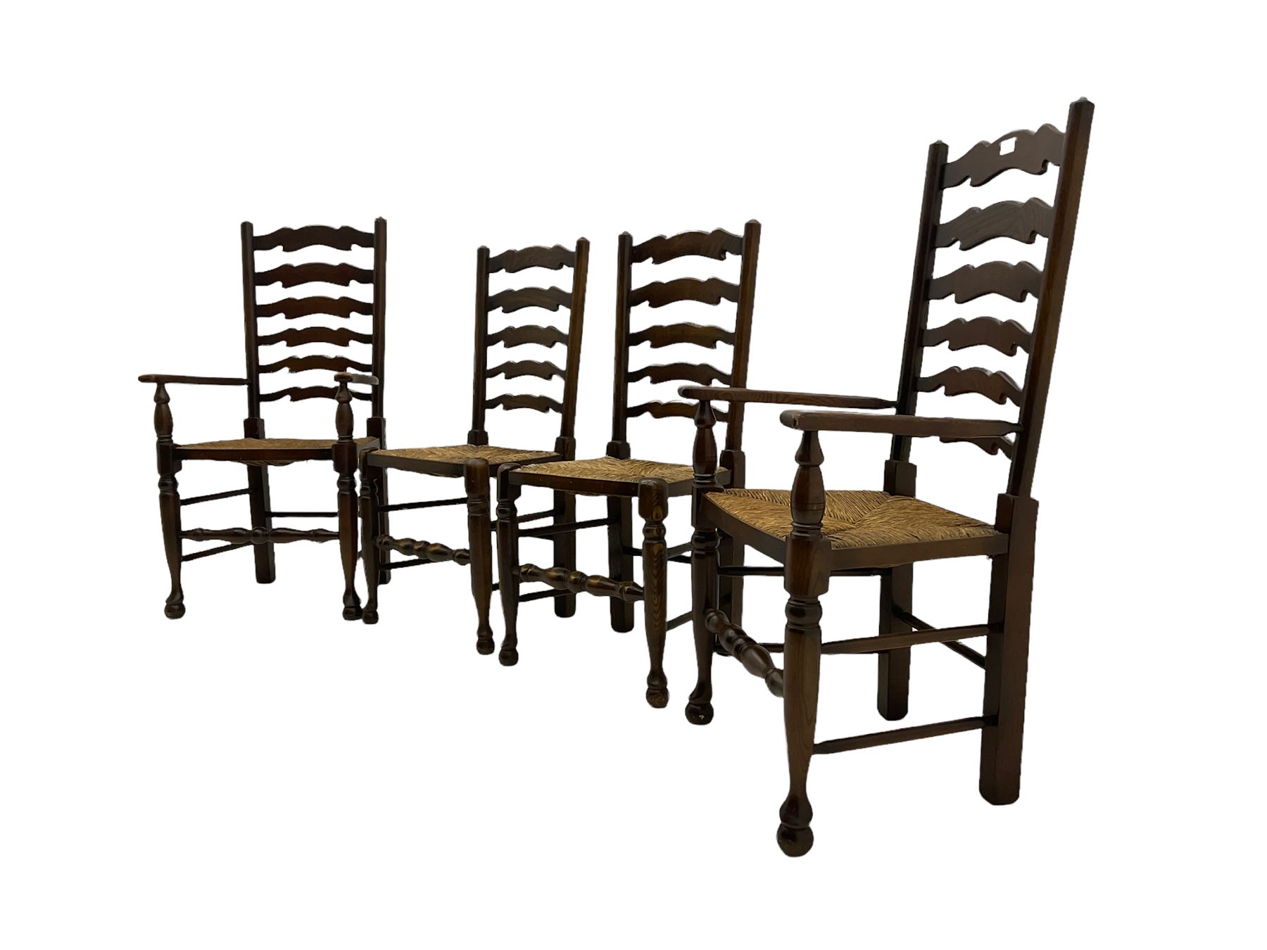 Set of four quality elm ladder back dining chairs, comprising two carver armchairs and two side chairs, with rush seats