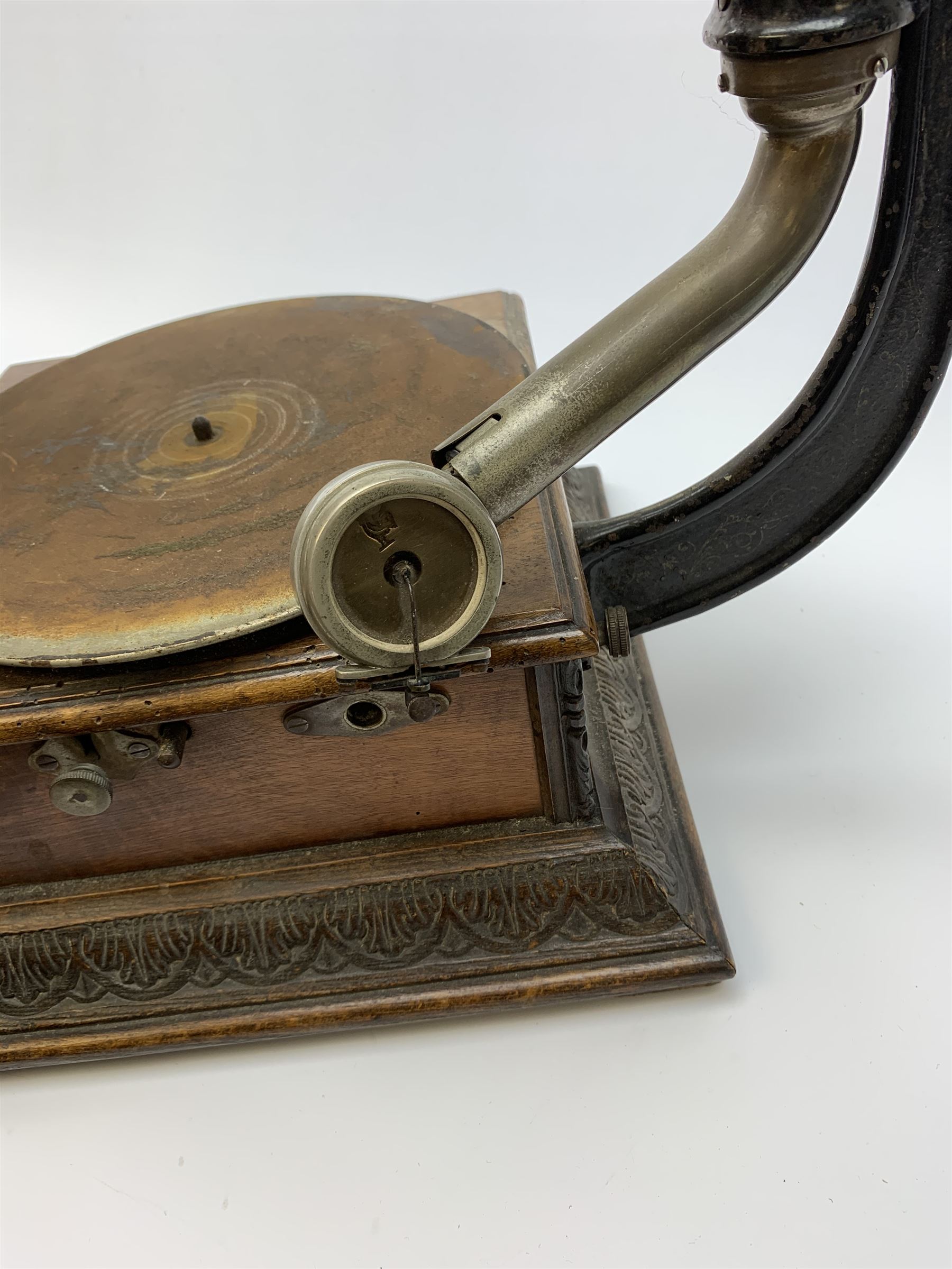 A wind up gramophone with red painted tin plate horn, upon a mahogany base, overall H71cm.