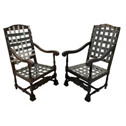 Two Carolean design open armchair frames, one in beech and the other in oak, high arched b...