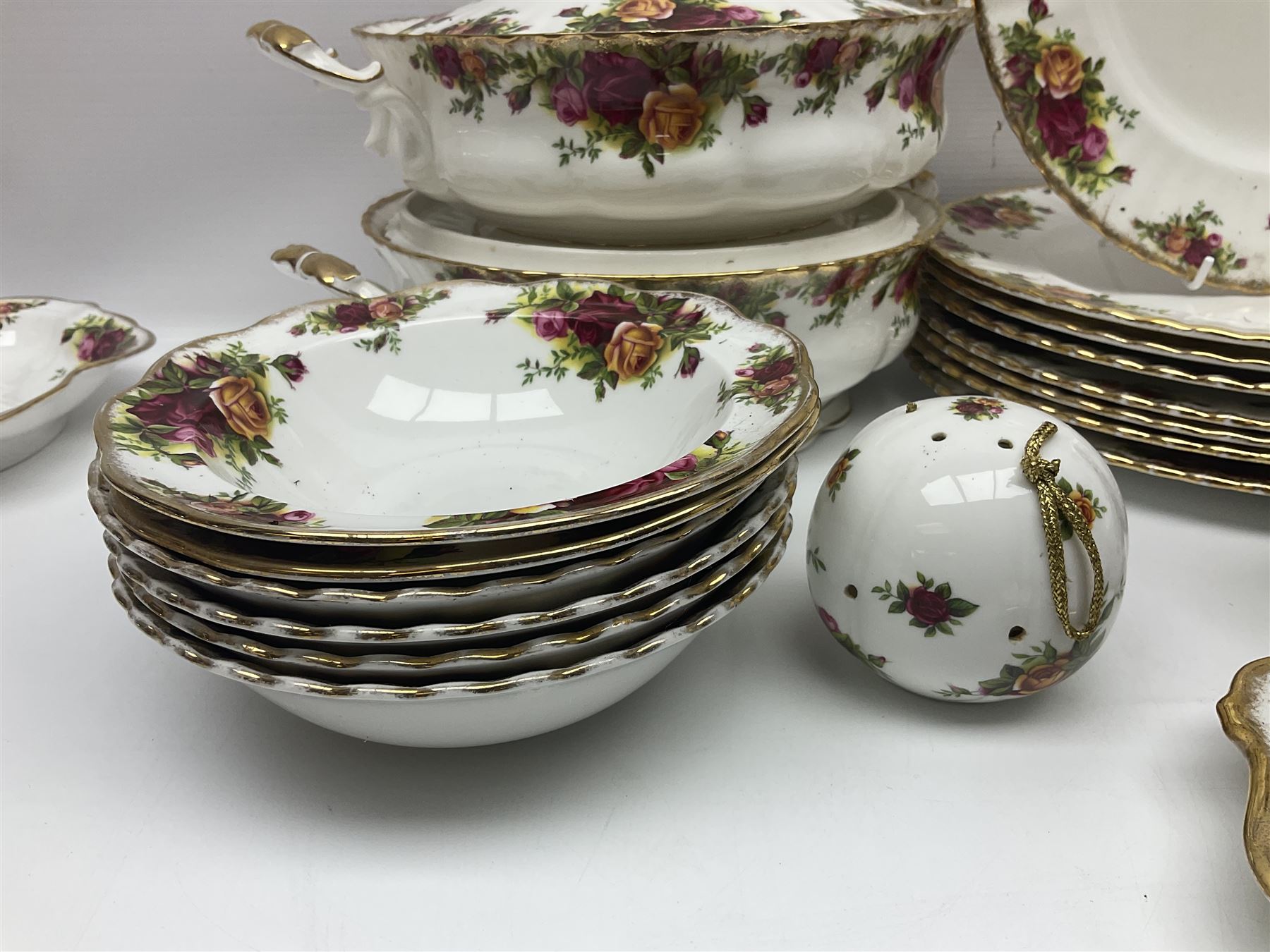 Royal Albert Old Country Roses pattern part tea and dinner service, to include two tureens, eight dinner plates, six side plates, twelve bowls, two mugs, seven teacups and saucers, milk jug,  twelve cake plates, six soup bowls and saucers, candlesticks, etc (95)