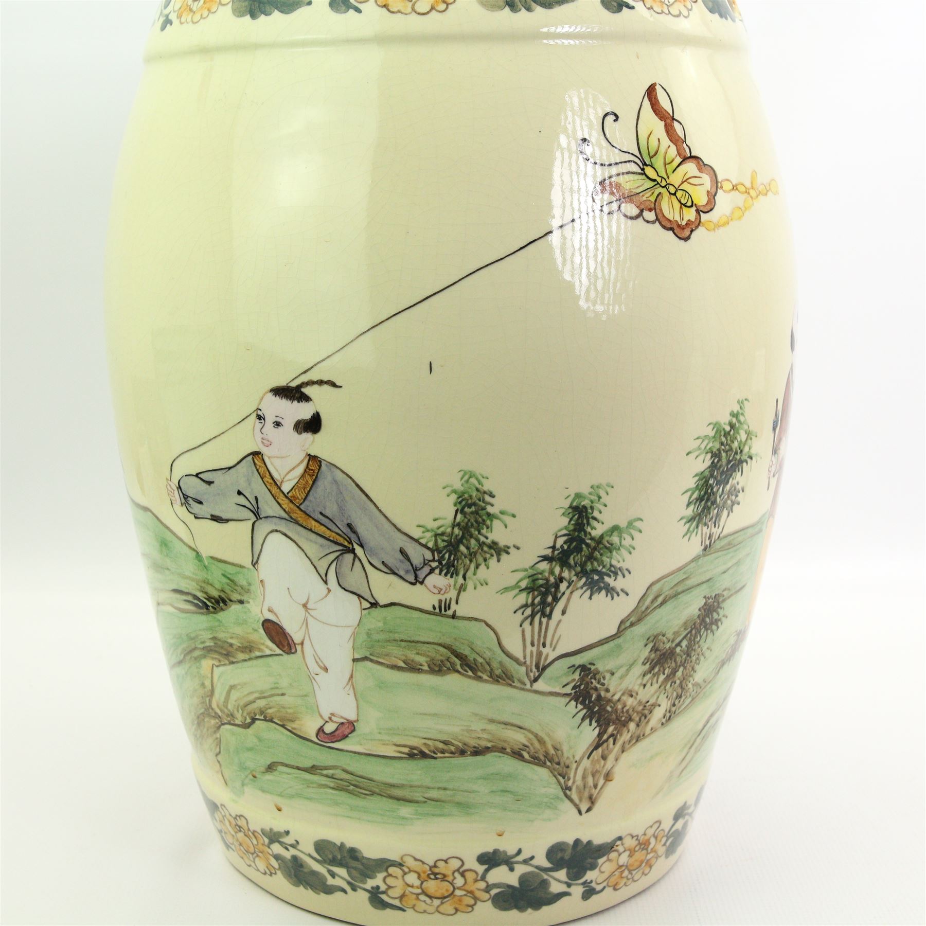 20th century oriental ceramic garden stool, of barrel form, painted with children playing in a rocky landscape, H45cm 