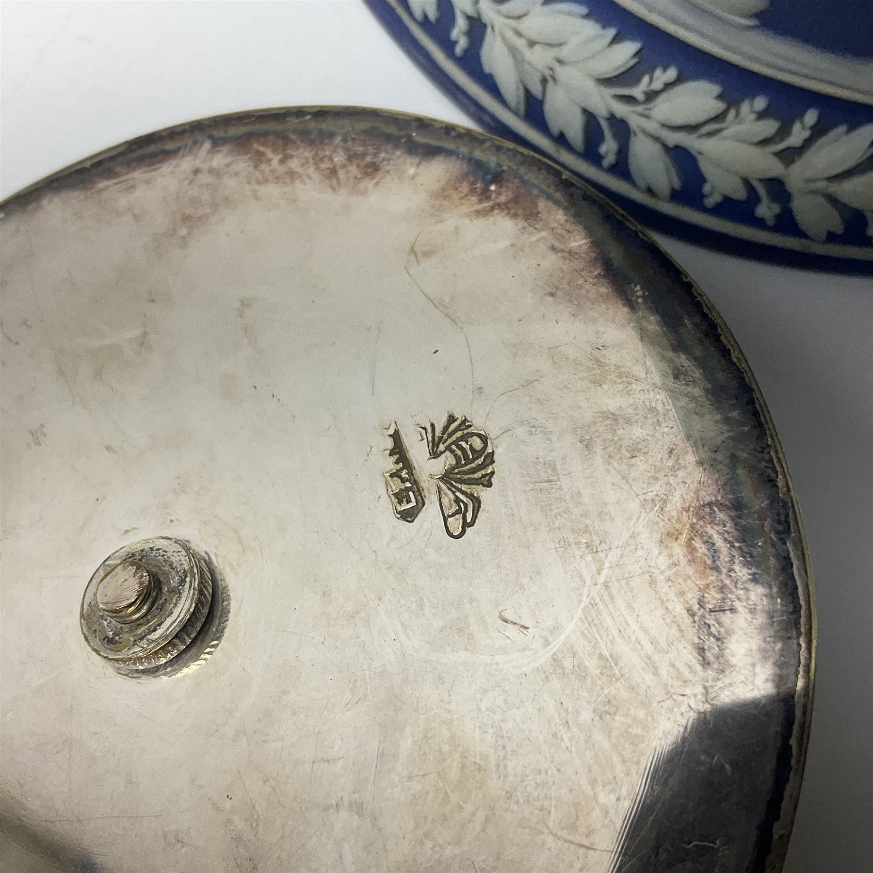 Morrisware bowl designed by George Cartlidge, model C19-15, of ciruclar form with inverted rim, painted with a band of pink flowers upon a green ground, with printed stamp beneath and painted facsimile signature, together with a Wedgwood Jasperware biscuit barrel, with silver plated lid and handle and a Doulton Burslem jug, with blue floral decoration upon a textured cream ground, bowl D28.5cm