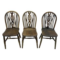 Mid-to-late 20th century set of six elm and beech Windsor dining chairs, hoop and stick back with pierced wheel splat, dished elm seat, on turned supports united by turned stretchers 