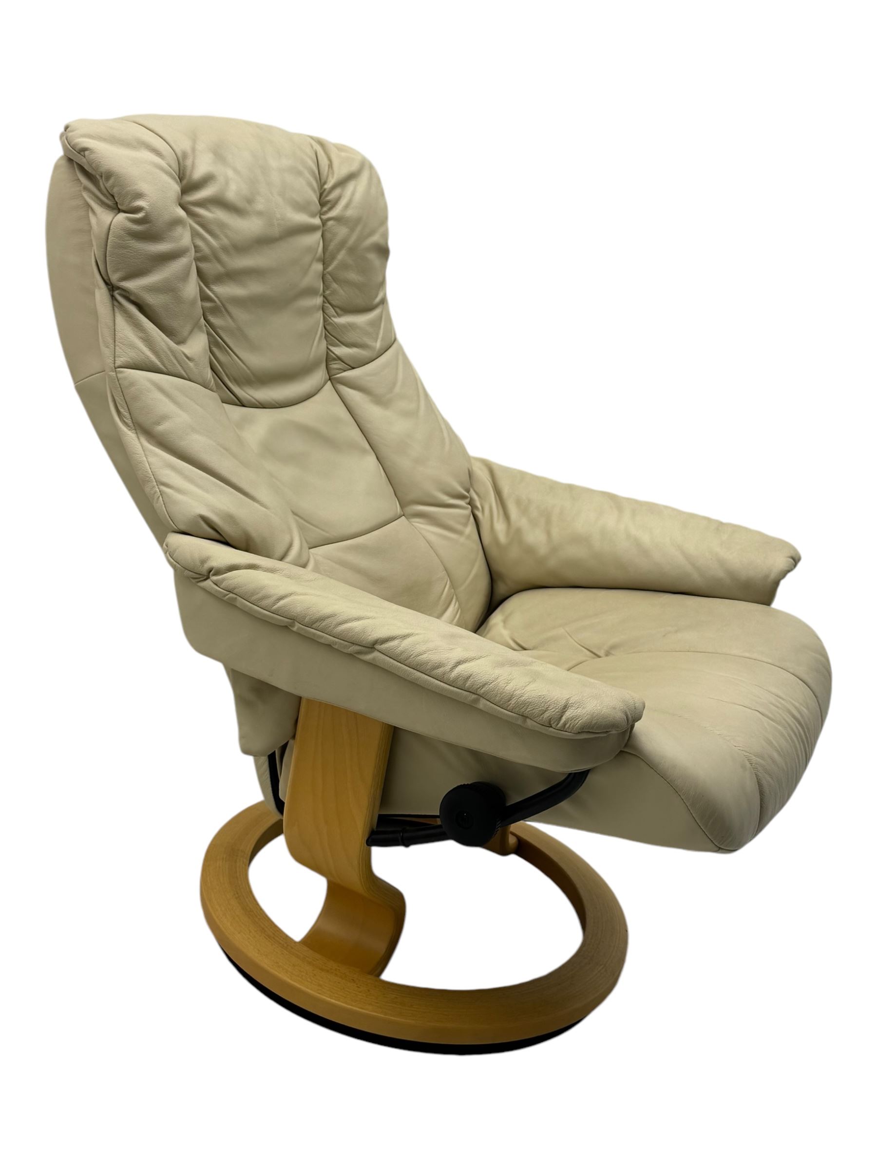 Ekornes Stressless - swivel armchair upholstered in cream leather (W81cm, H103cm); together with matching stool (W49cm)