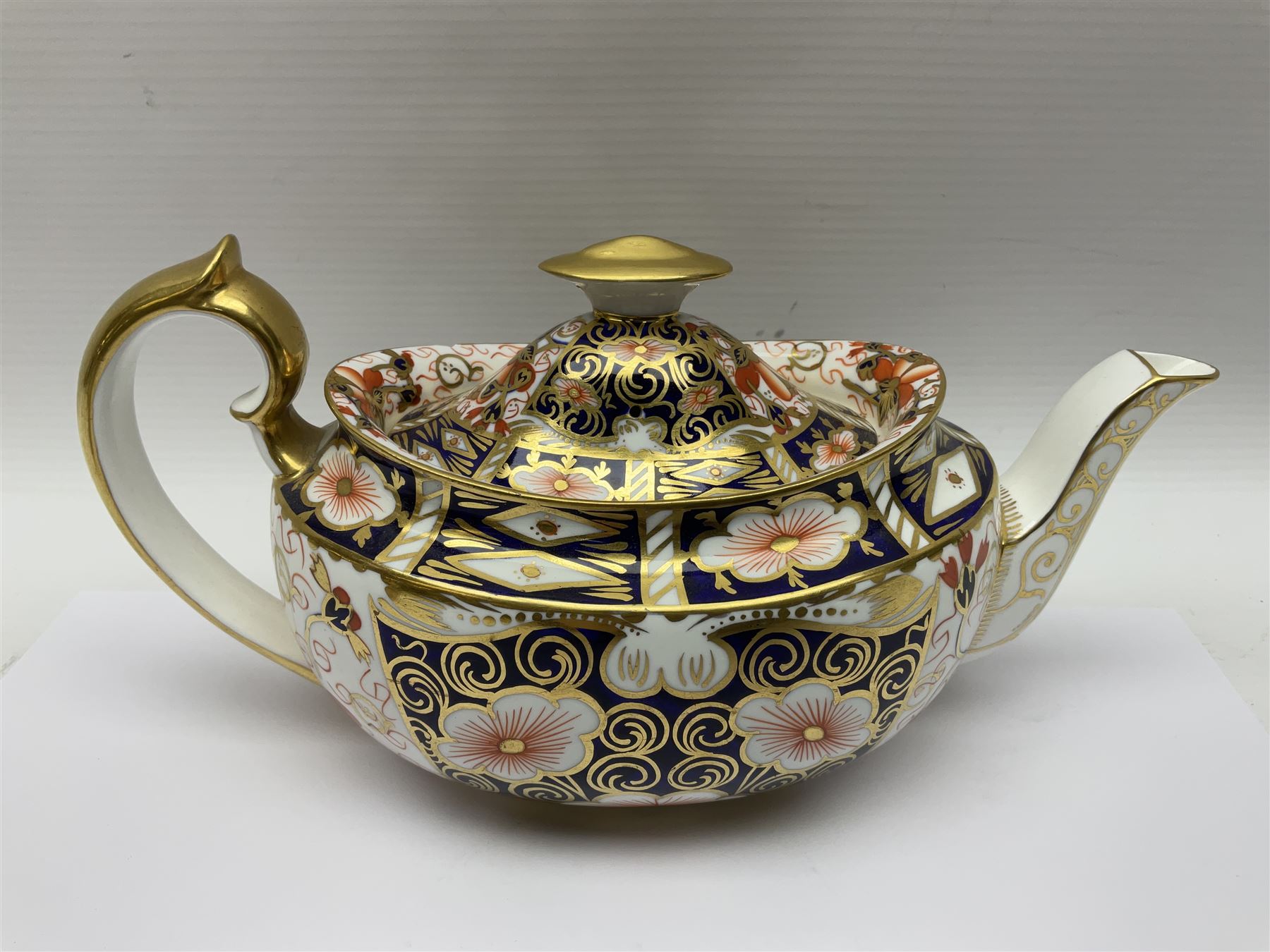 Royal Crown Derby 2451 Imari pattern three piece tea set, comprising teapot, covered sucrier and milk jug, teapot H12cm 