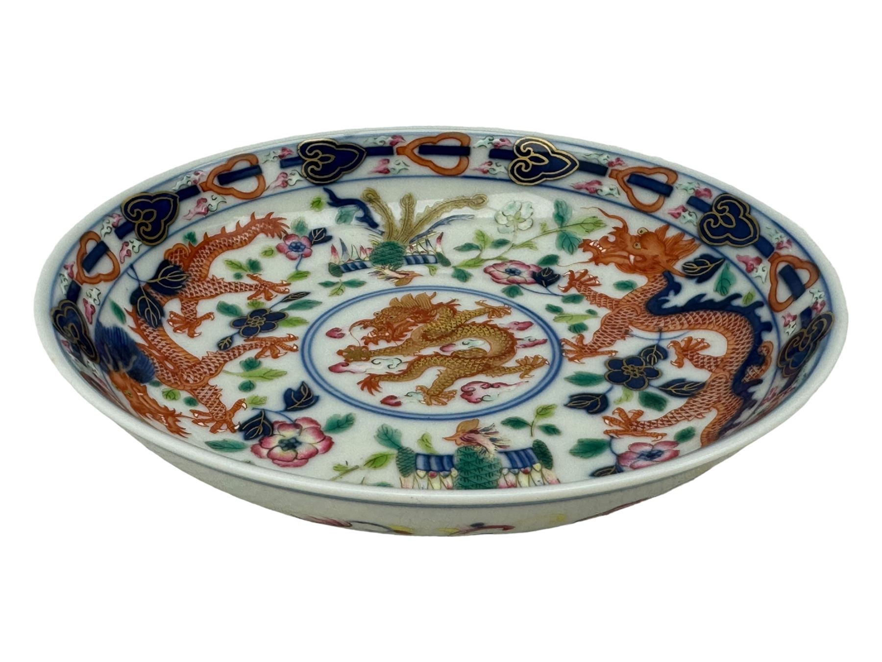 Pair of Chinese 'Dragon & Phoenix' porcelain saucers, centrally painted with a five claw dragon chasing the flaming pearl in iron red and gilt, within a border of confronting Dragons and Pheonix, amongst floral blooms, six character Guangxu mark beneath, D13.5cm