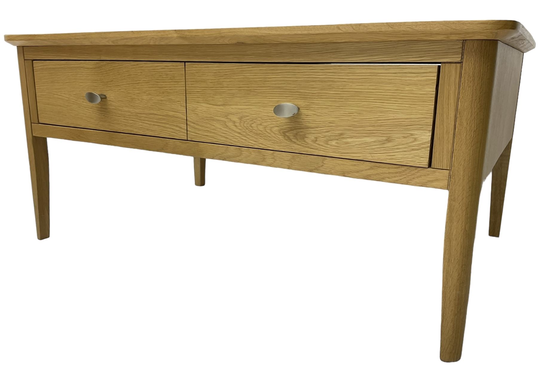 Contemporary light oak rectangular coffee table, fitted with single drawer disguised as two drawers to each side, on tapering supports