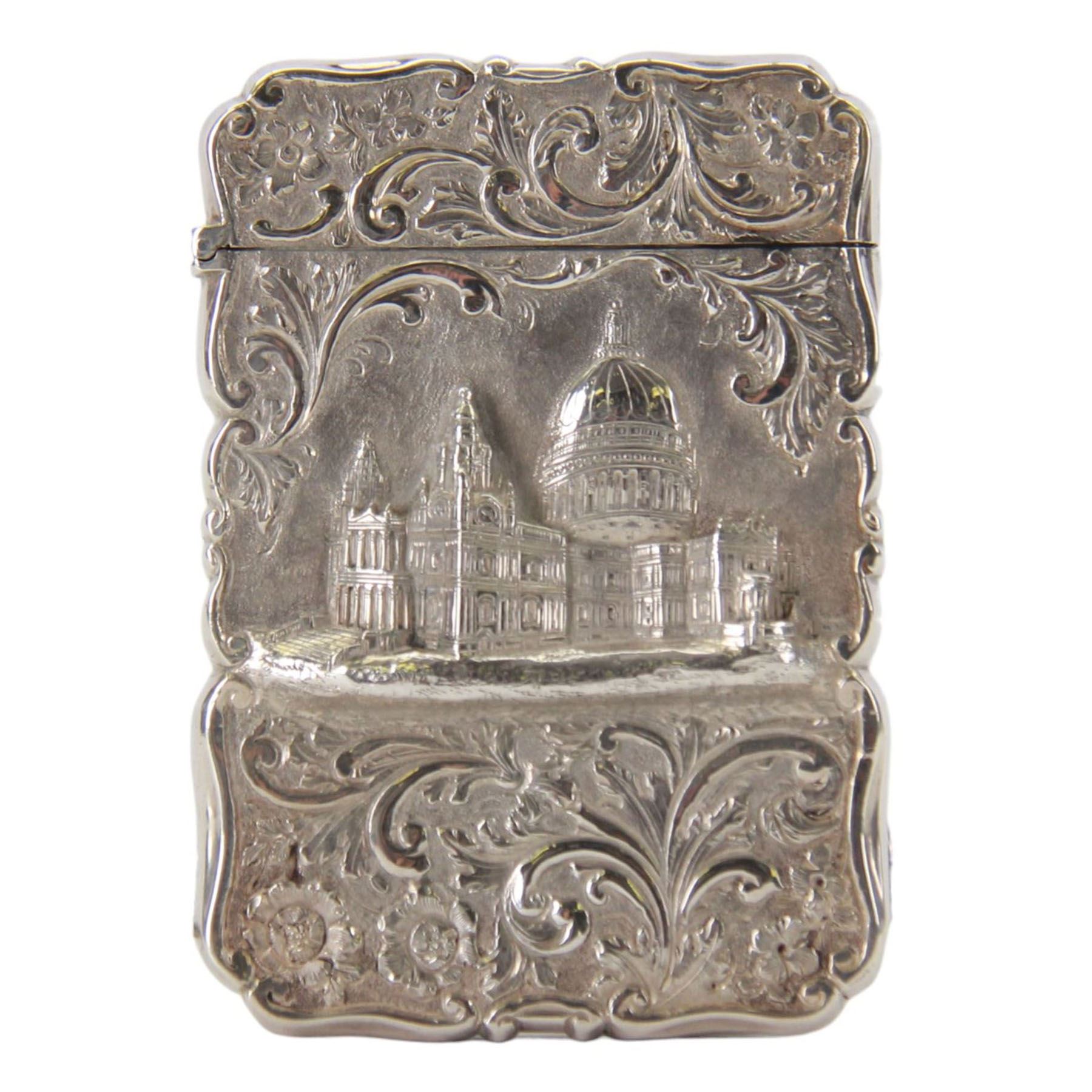 Victorian silver castle-top card case, of rectangular form with scrolling sides, relief embossed with the St Paul's Cathedral and surrounded by foliate scrolls, with vacant cartouche to reverse, hallmarked Nathaniel Mills, Birmingham, probably 1847, H8.5cm W6cm
