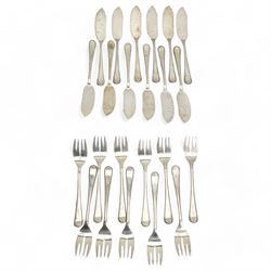 Set of twelve Dutch silver fish knives and eleven forks with reeded edge with Minerva Head duty mark and The Hague assay