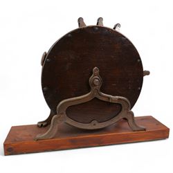 Edwardian knife polisher by Spong and retailed by B & E Bushell, York, on cast iron base and mounted on later wooden stand, H51cm x L67cm