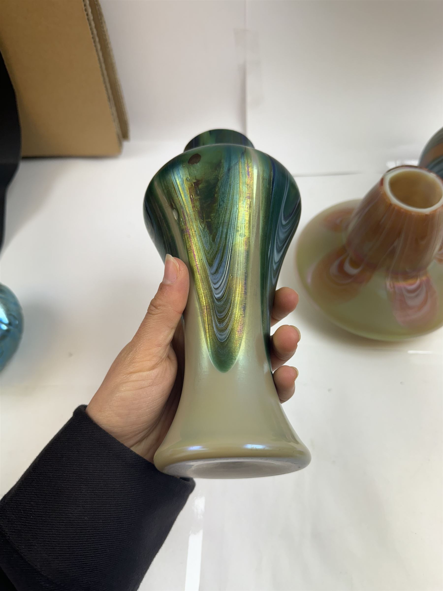 Three Austrian Art Nouveau iridescent glass vases by Rindskopf, all of varying form, each with pulled feather decoration to body, tallest H20.5cm